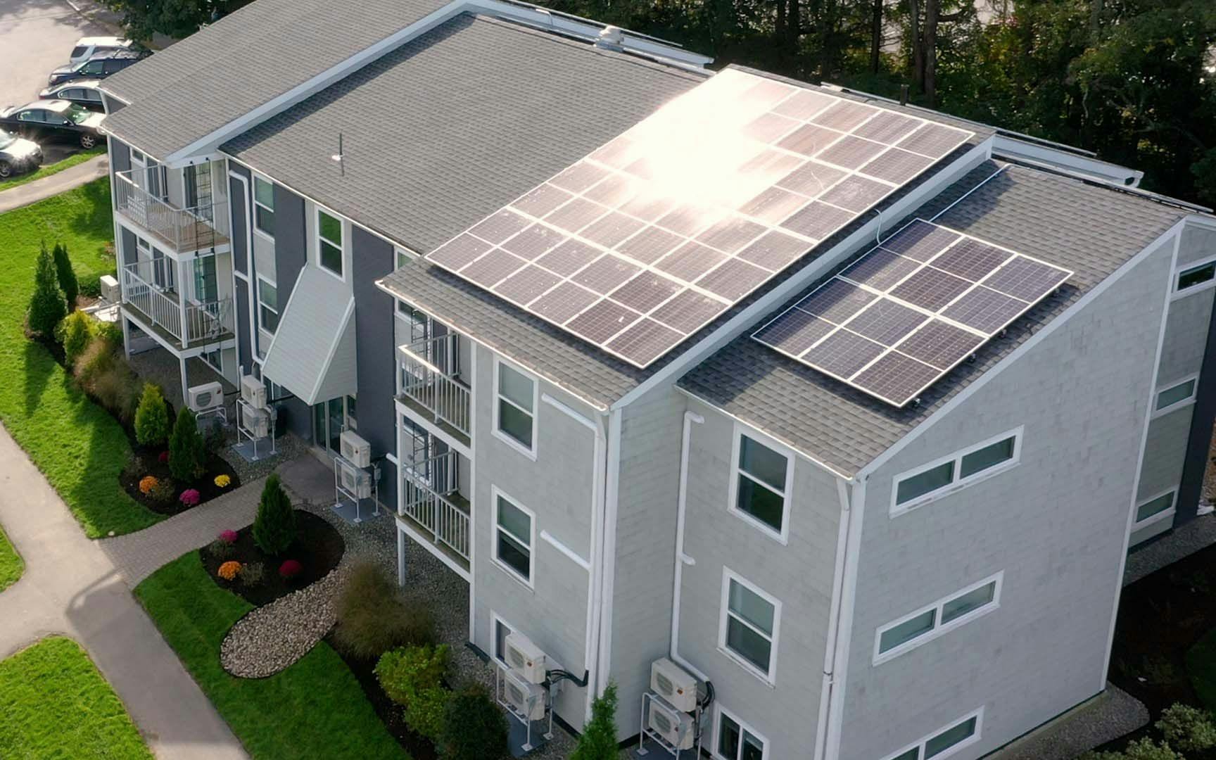 Solar panels on an apartment complex roof.