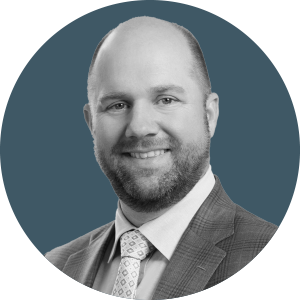 a headshot of Matthew Cox from Smith Currie OIes