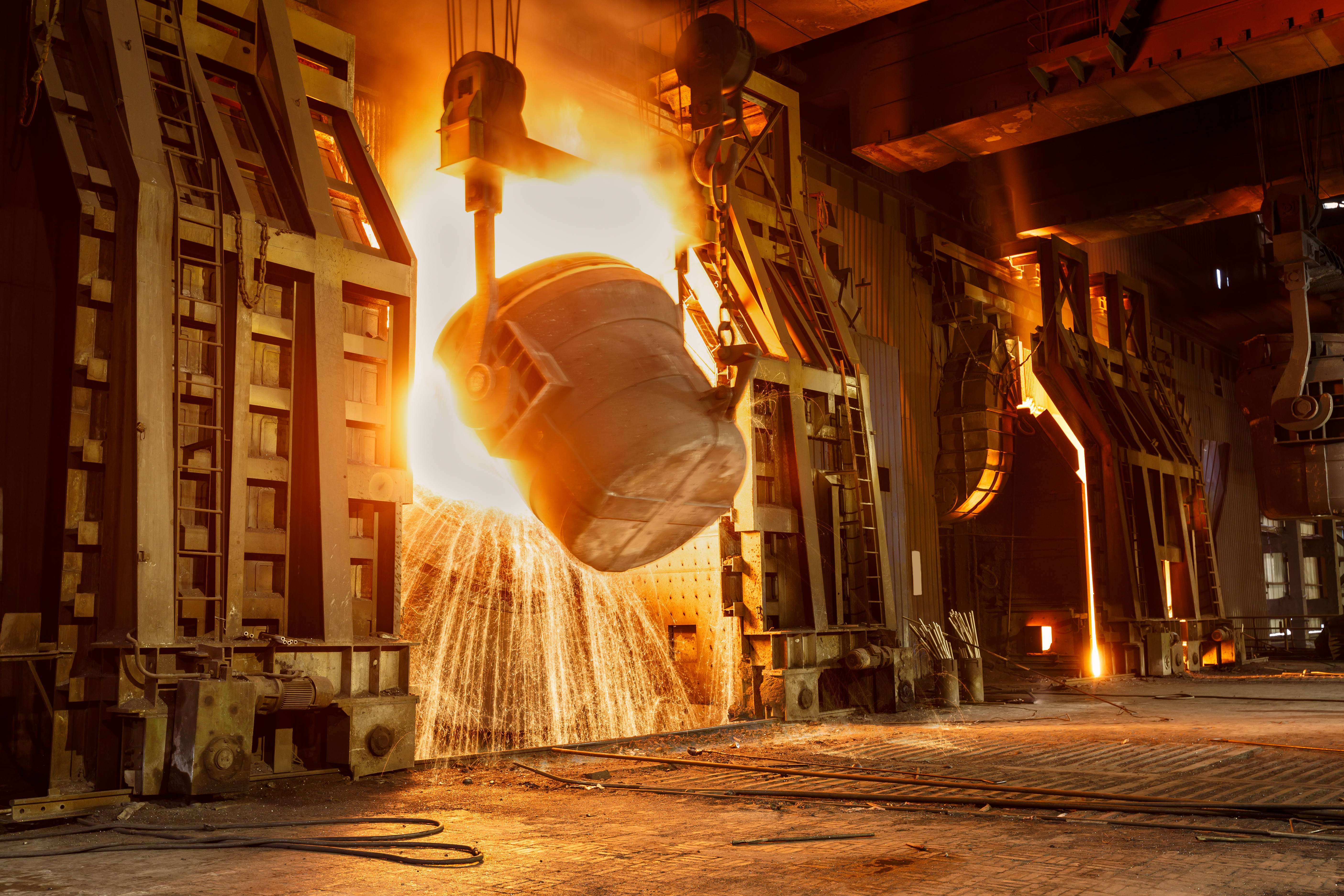 a large container of molten metal smelting iron into steel