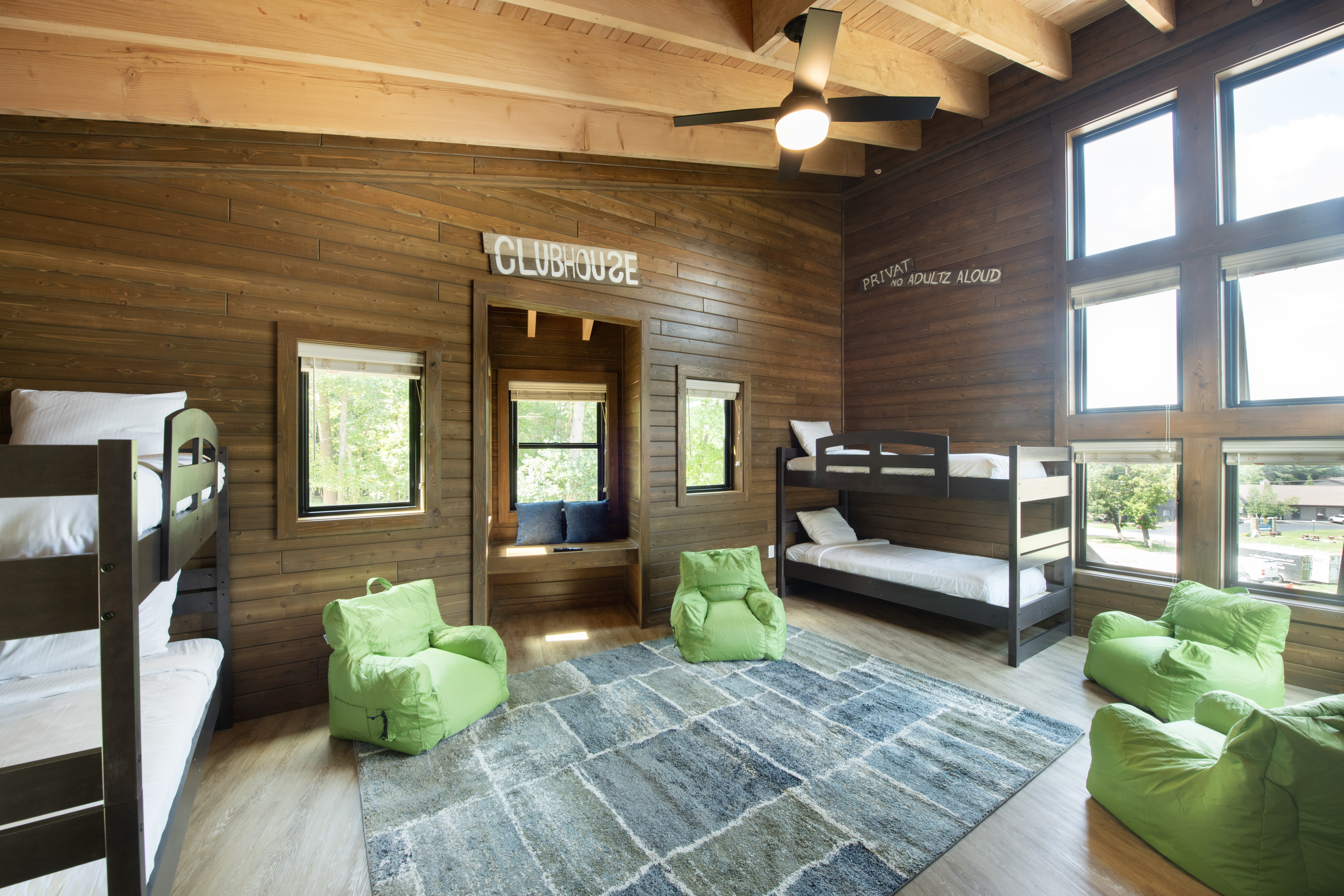 bunk beds inside of a luxury treehouse cabin
